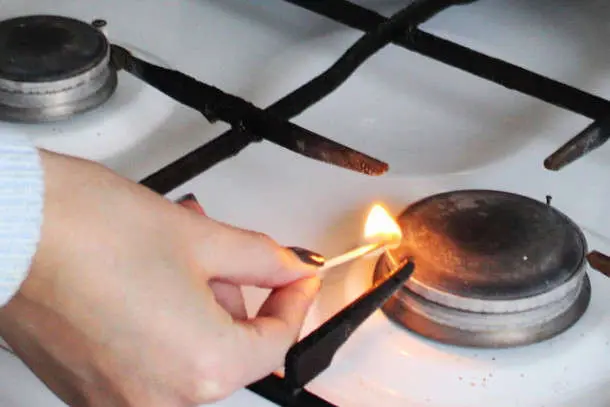 Gas burner in front of a gas meter