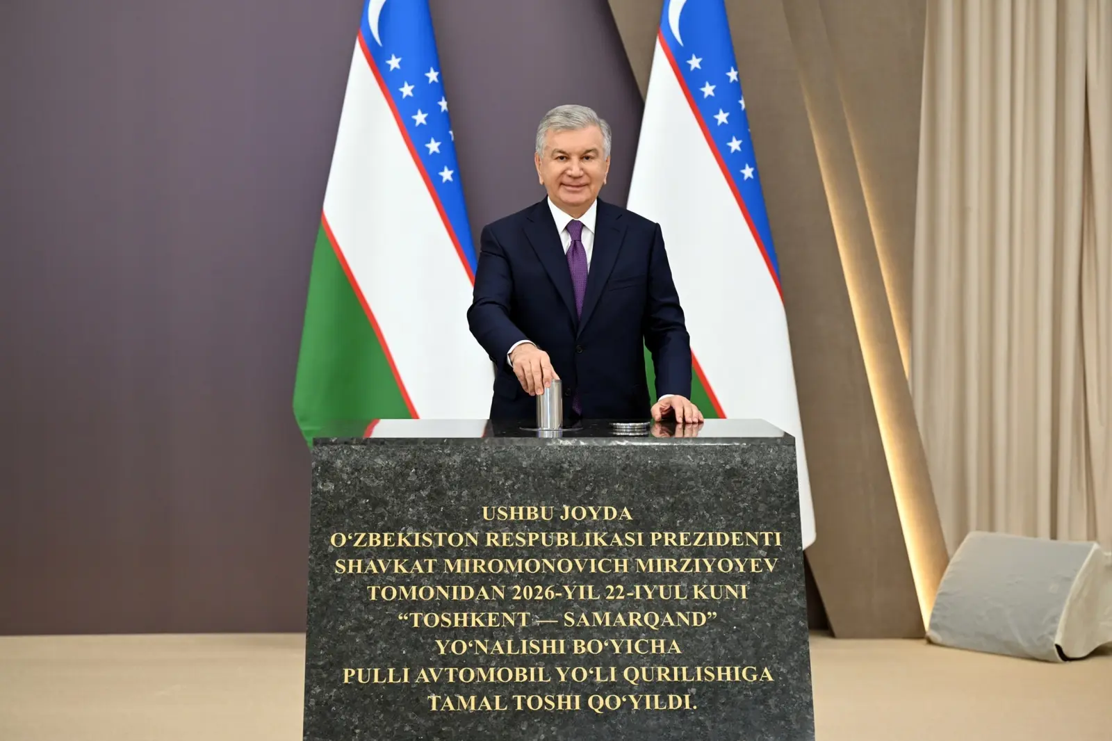 Shavkat Mirziyoyev places a capsule at the foundation of the Tashkent–Samarkand toll motorway on 22 July 2026