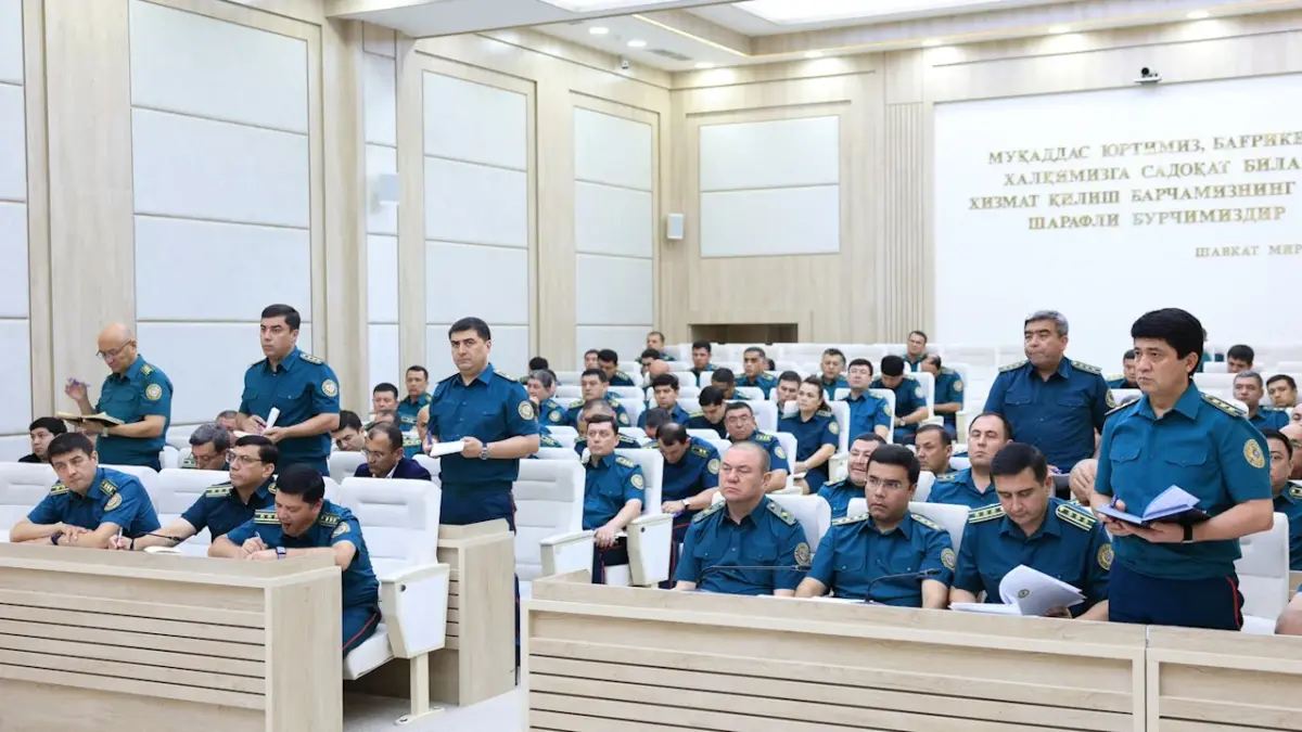 Uzbekistan Interior Ministry personnel at a board meeting reviewing operational results