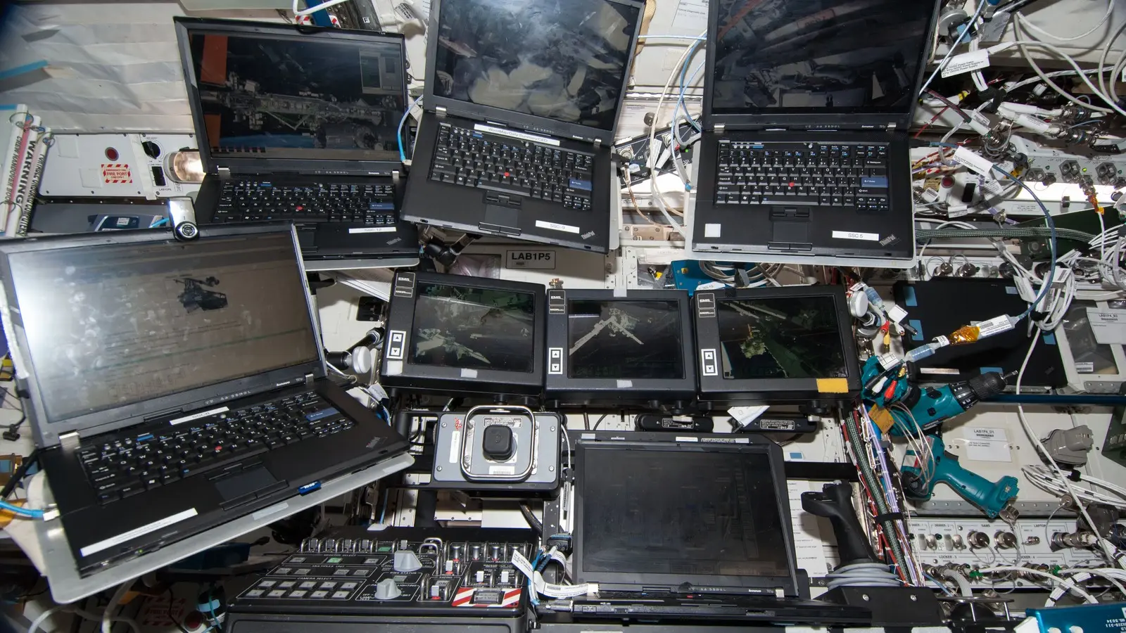 ThinkPad laptops at a workstation in the US module of the ISS