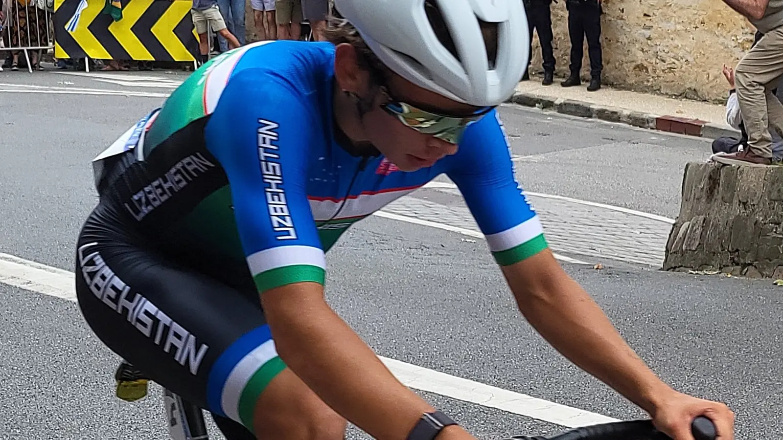 Nikita Tsvetkov competes in Uzbekistan national team kit during a cycling race