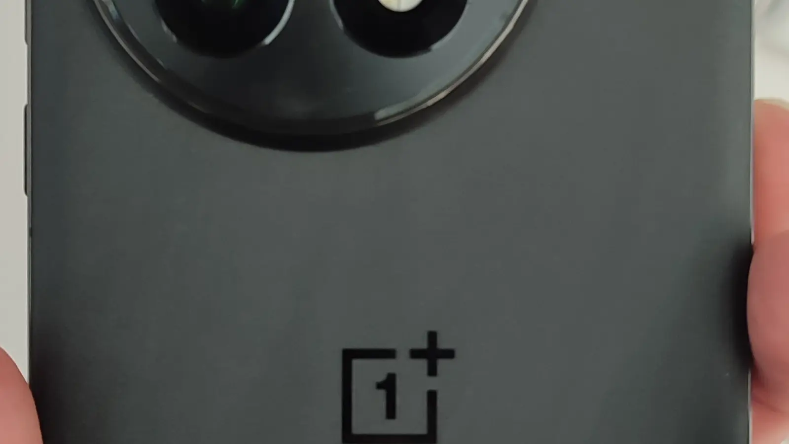 A modern OnePlus 13 smartphone