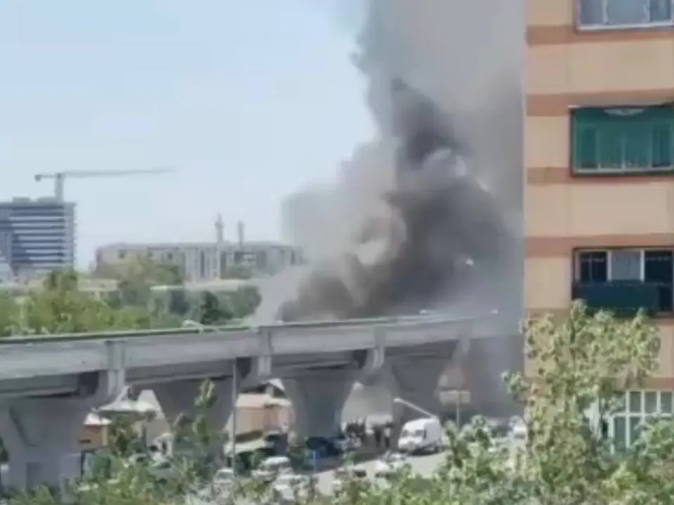 Firefighters tackling a house fire in Tashkent’s Yangihayot district