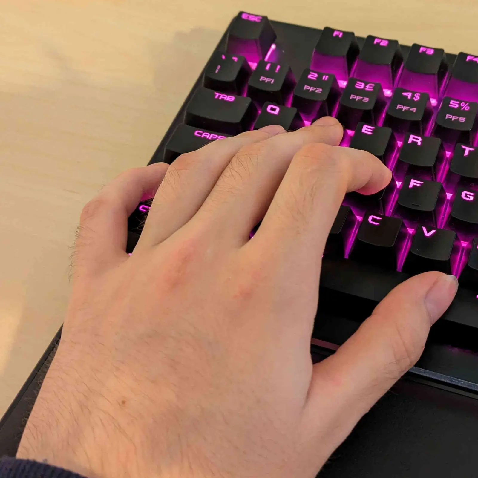 A person’s hands on a computer keyboard