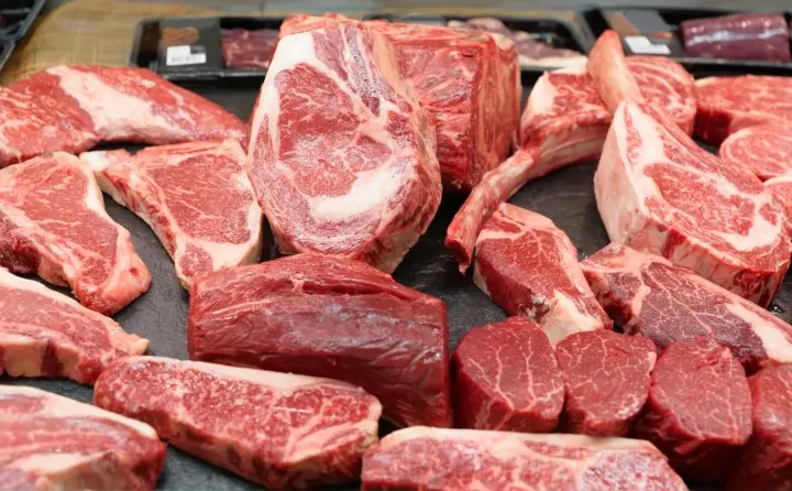 Assorted cuts of beef displayed at a meat counter