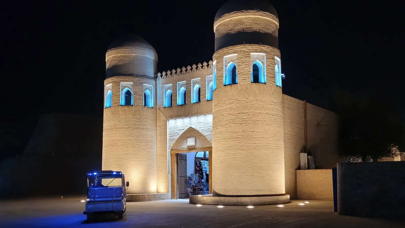 The west gate of Itchan Kala in Khiva at night, contextual photo